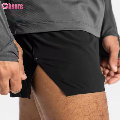 Bolsillos de cremallera personalizados cintura elástica deportes activos de ropa masculina Jacquard impresión entrenamiento corriendo calzoncillos de gimnasio