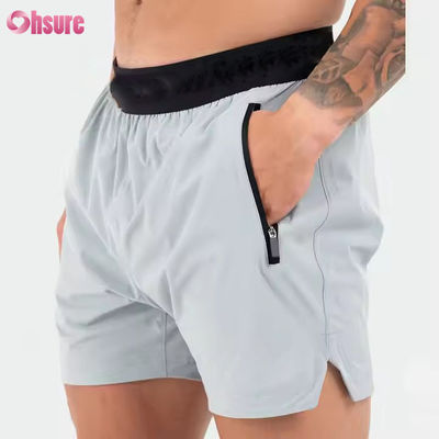 Logotipo personalizado en cinturón Poliéster Bolsillos Split Hem Pour Hombres Deportes Activos Hombres Entrenamiento Gimnasio Calzoncillos Atléticos Para Hombres