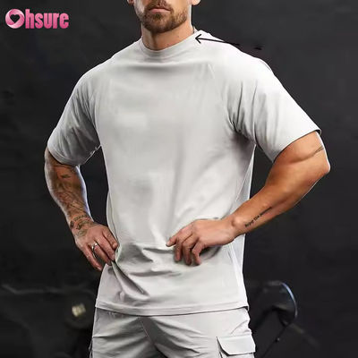 Camiseta de entrenamiento para hombre, de cuello redondo, manga corta raglán, ajuste relajado, 95% algodón y spandex