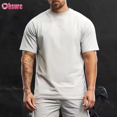 Camiseta de entrenamiento para hombre, de cuello redondo, manga corta raglán, ajuste relajado, 95% algodón y spandex
