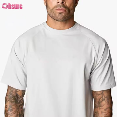 Camiseta de entrenamiento para hombre, de cuello redondo, manga corta raglán, ajuste relajado, 95% algodón y spandex