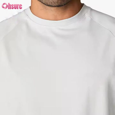 Camiseta de entrenamiento para hombre, de cuello redondo, manga corta raglán, ajuste relajado, 95% algodón y spandex