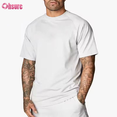 Camiseta de entrenamiento para hombre, de cuello redondo, manga corta raglán, ajuste relajado, 95% algodón y spandex