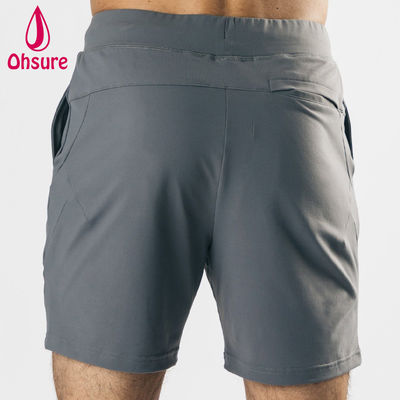Diseño de logotipo personalizado por el fabricante, material ligero, elástico en cuatro direcciones, bolsillos delanteros profundos, pantalones cortos deportivos para hombre, pantalones cortos de entrenamiento para gimnasio