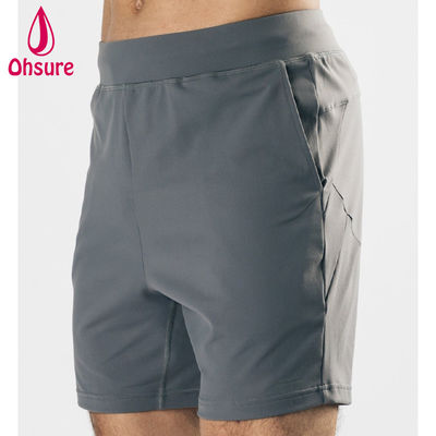 Diseño de logotipo personalizado por el fabricante, material ligero, elástico en cuatro direcciones, bolsillos delanteros profundos, pantalones cortos deportivos para hombre, pantalones cortos de entrenamiento para gimnasio