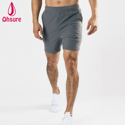 Diseño de logotipo personalizado por el fabricante, material ligero, elástico en cuatro direcciones, bolsillos delanteros profundos, pantalones cortos deportivos para hombre, pantalones cortos de entrenamiento para gimnasio