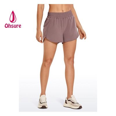 Pantalones cortos deportivos de secado rápido, nuevos pantalones cortos de cintura alta con diseño casual para mujer, logotipo personalizado, tallas grandes, tejido estampado, soporte para muestra personalizada