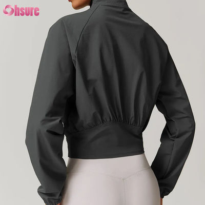 Chaquetas de entrenamiento con cremallera de alta calidad para mujer, fitness personalizado, cuello alzado, tops de yoga a prueba de viento, venta al por mayor, tejido de invierno, insignia