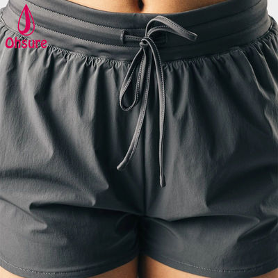 Pantalones cortos deportivos atléticos de cintura alta de diseño OEM de alta calidad para mujer, fitness, gimnasio, correr, yoga, pantalones cortos, tejido casual