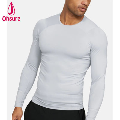 Venta al por mayor de ropa de gimnasia de oferta Camiseta de compresión para hombre de ajuste delgado Ropa deportiva para hombre Camisetas de manga larga para hombre Jersey Cuello redondo informal en blanco