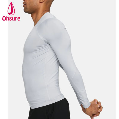 Venta al por mayor de ropa de gimnasia de oferta Camiseta de compresión para hombre de ajuste delgado Ropa deportiva para hombre Camisetas de manga larga para hombre Jersey Cuello redondo informal en blanco